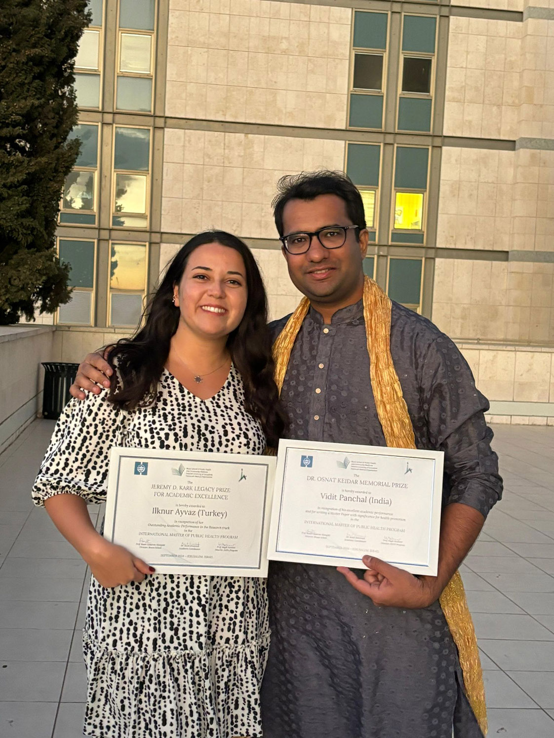 Dr. Ilknur Ayvaz from Turkey recipient of The Jeremy D. Kark Legacy Prize for Academic Excellence, in recognition of her outstanding academic performance in the Research Track, stands with Dr. Vidit Panchal from India, the recipient of the Dr. Osnat Keidar Memorial Prize in recognition of his excellent academic performance overall and in particular, for his Master Paper, “Designing and Establishing a Pulmonary Rehabilitation Unit in a Primary Health Centre of Rural Chhattisgarh, India: Proposal for A Randomized Controlled Trial,” with significance for health promotion.